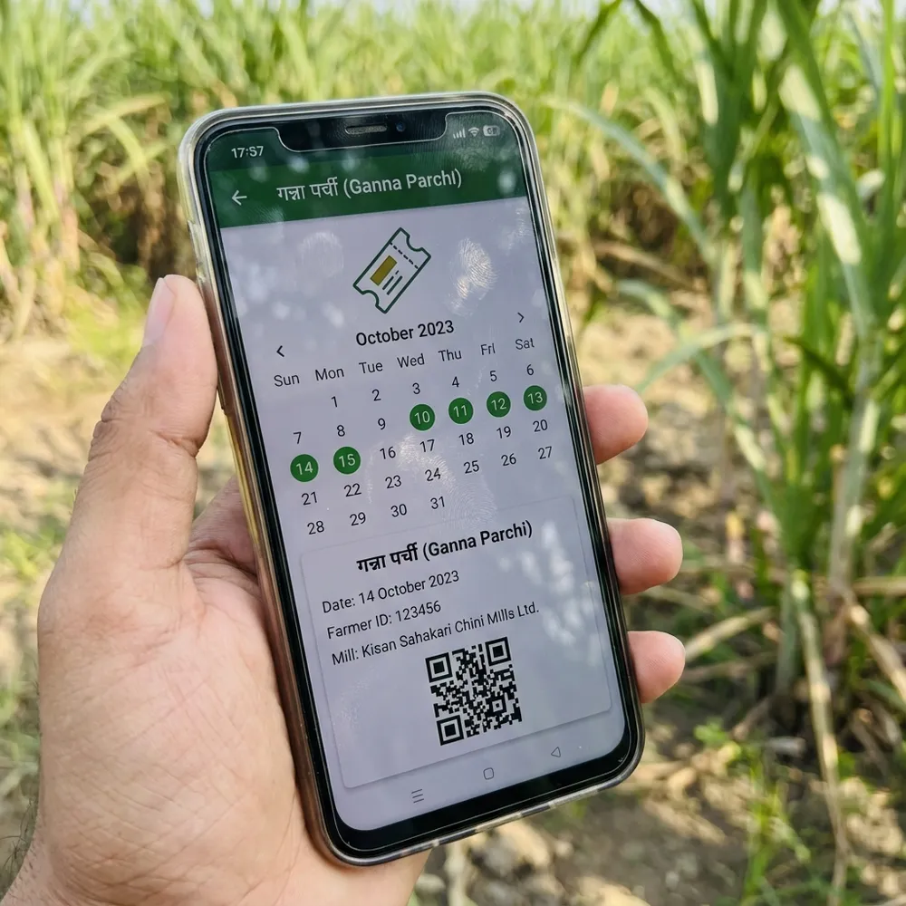 Farmer using mobile to check Ganna Parchi